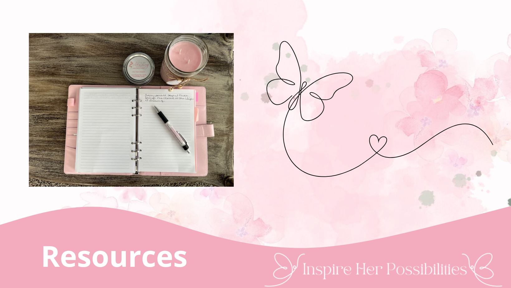 Cozy workspace with a candle and binder, symbolizing tools and resources for women’s empowerment.